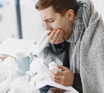 sick man coughing blanket/Alpha-1-antitrypsin deficiency (AATD)
